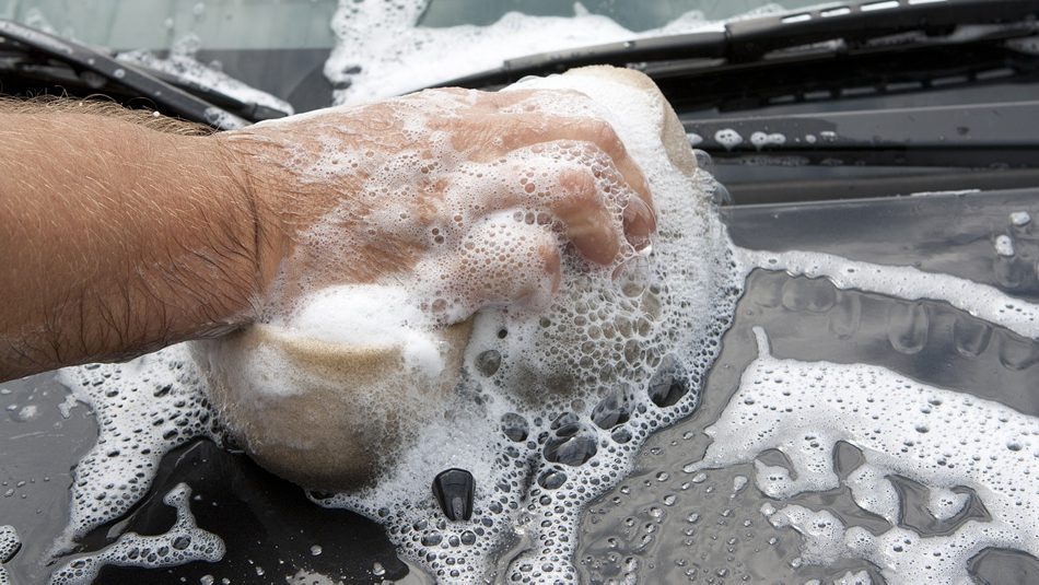 washing car with a sponge