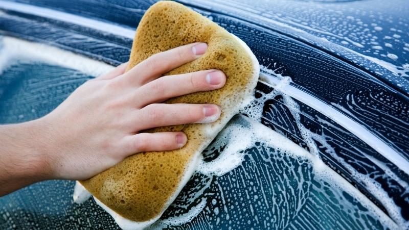 washing car with a sponge