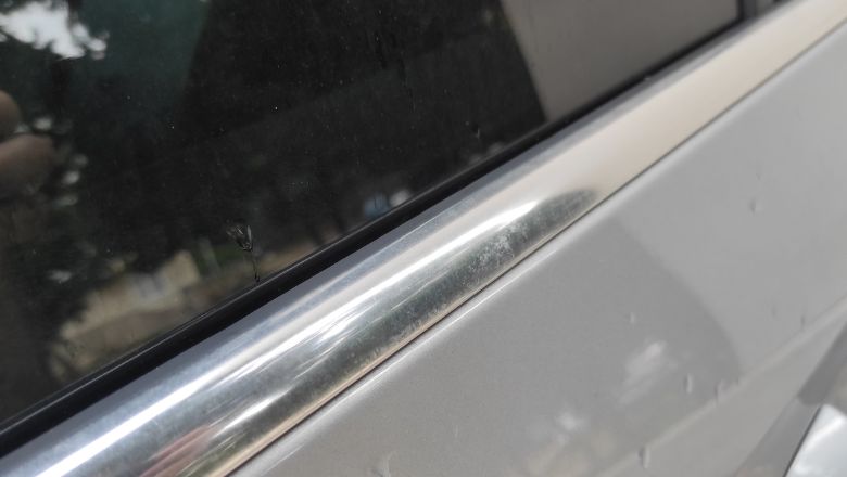 water spots on chrome trim on car