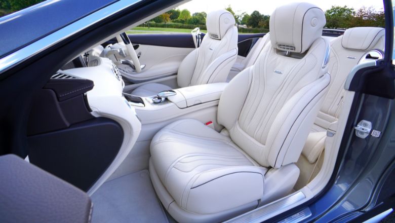 white leather car seats in car, protected with ceramic coating