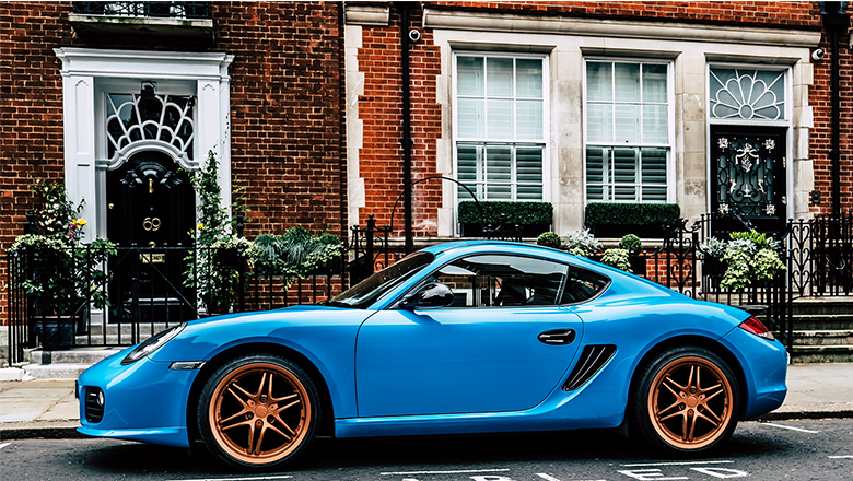 bronze wheels on a blue car
