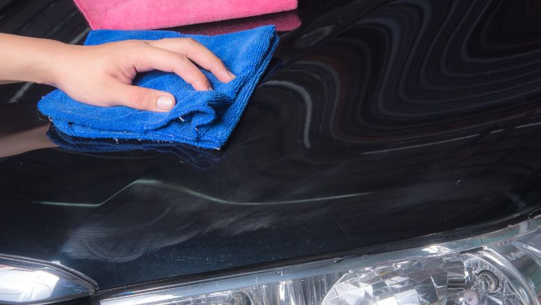 wiping off polishing residue from a car
