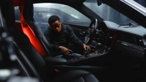 guy cleaning car interior